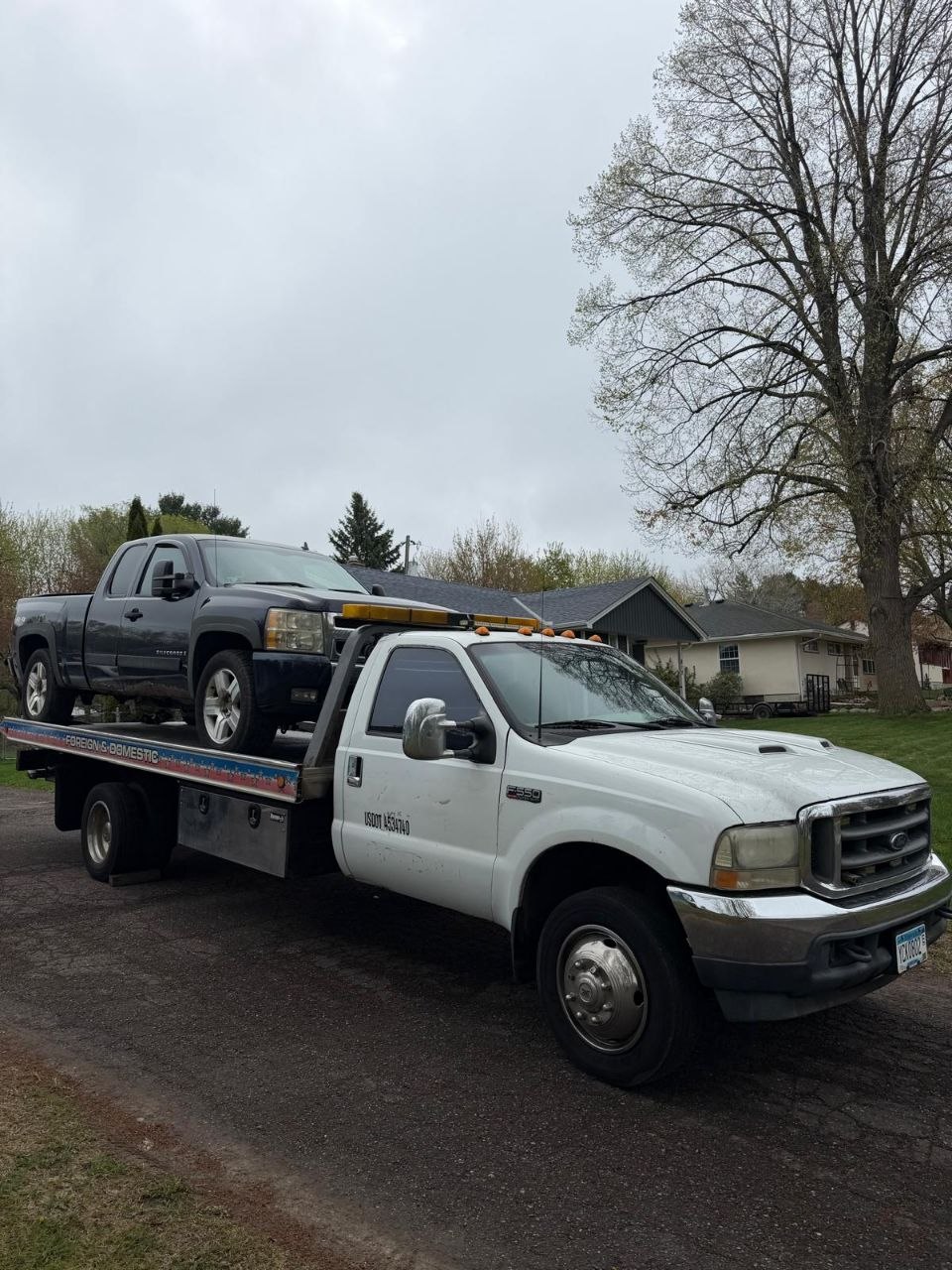 Alexander LLC Towing flatbed truck