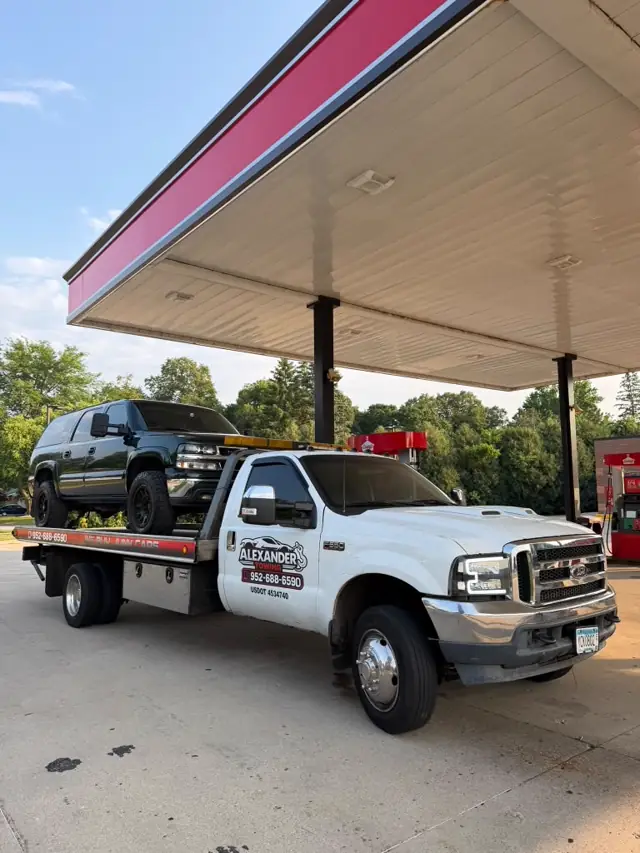 Pickup truck towing near a gas station in Minnesota