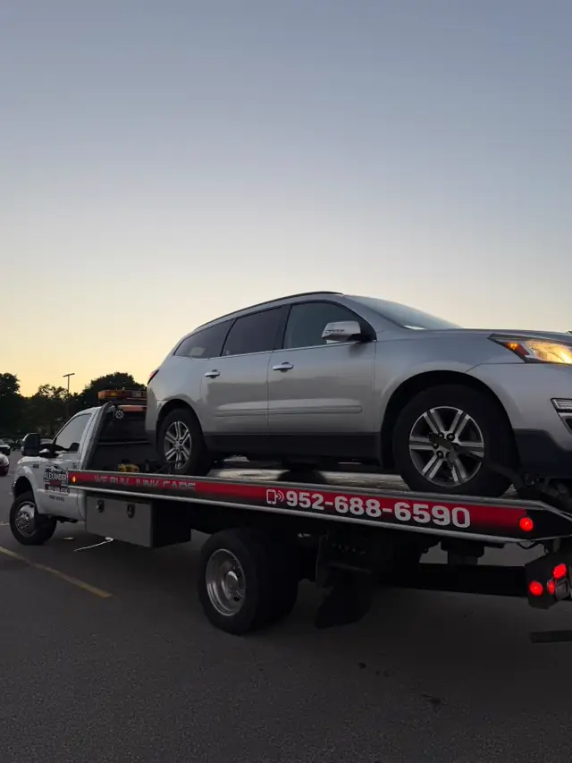 SUV towing at dusk in Minnesota