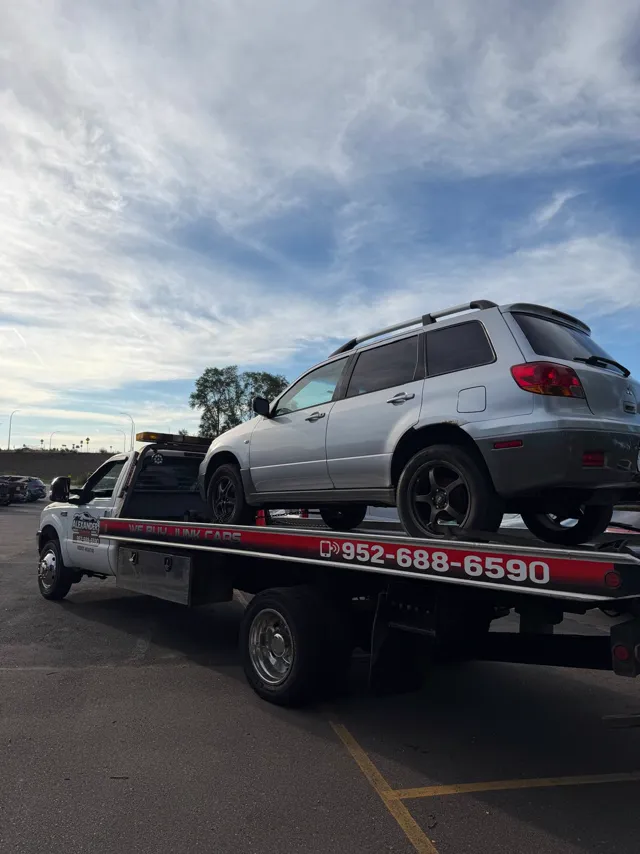 SUV towed from a retail parking lot in West St. Paul, MN