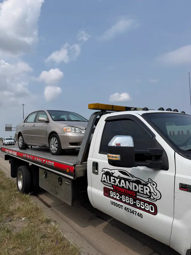 Toyota Corolla loaded on an Alexander Towing flatbed in Minnesota