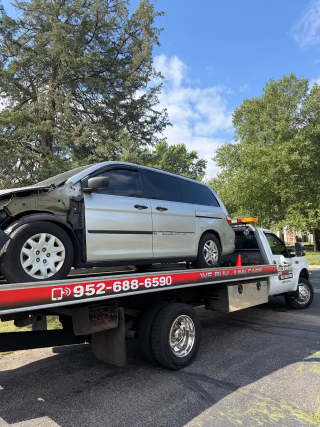 Minivan with front-end damage towed in the Twin Cities