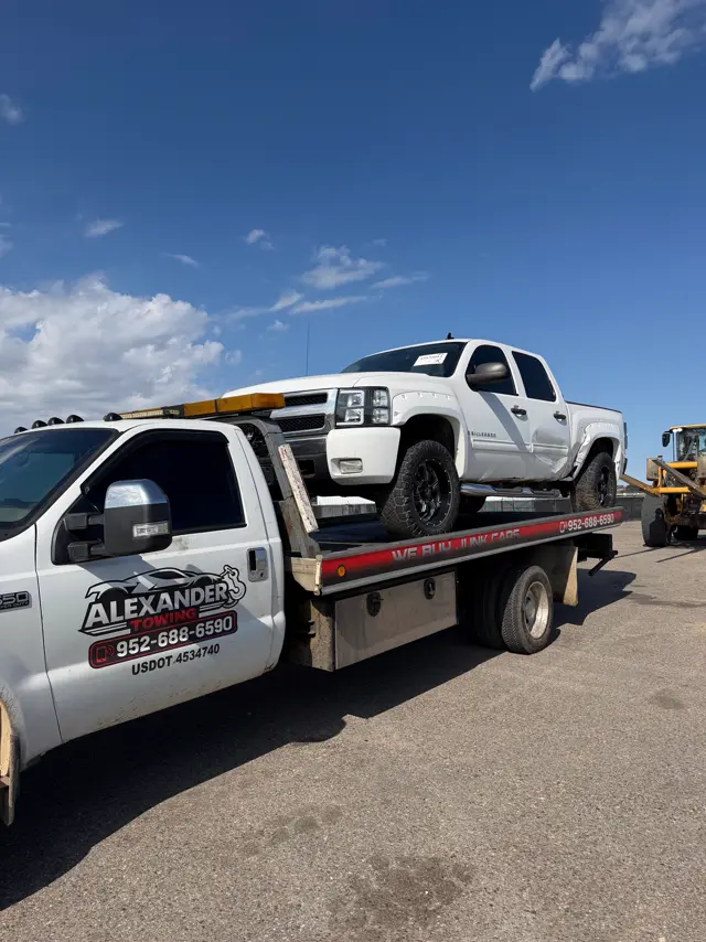 Chevrolet Silverado work truck on a flatbed in Minnesota