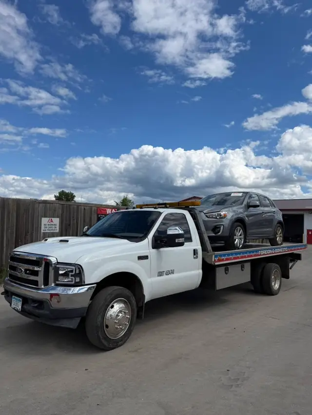 Mitsubishi SUV flatbed towing Minnesota